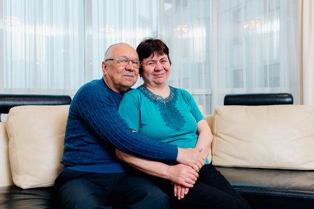 Senior couple old woman and senior man. Loving old senior family couple bonding embracing. romantic middle aged mature man and woman hugging getting closer enjoying moment of affection cuddling,の写真素材