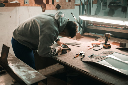Professional tinsmith working with metal, workshop. Handmade, craftsmanship and blacksmithing...