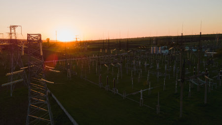 Silhouette High voltage electric tower on sunset time and sky on sunset time background. high...