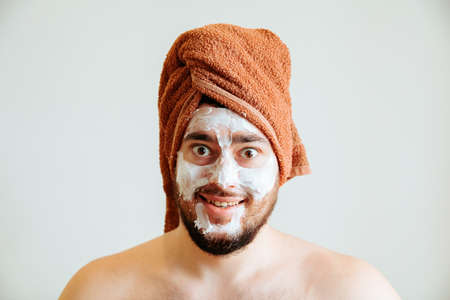 funny happy man with mask leads healthy lifestyle, looking at camera. positive emotion in the morning.の写真素材
