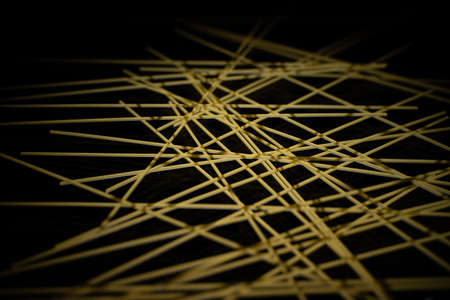 raw spaghetti on black background, Italian pastaの写真素材