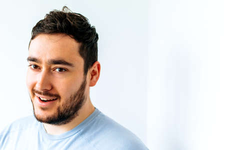 Happy young bearded man. Portrait of handsome young man in casual shirt nice middle age man with a happy face standing and smilingの写真素材
