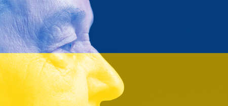 close up of a old woman face in ukraine flag colors. ukraine crisis conceptの写真素材