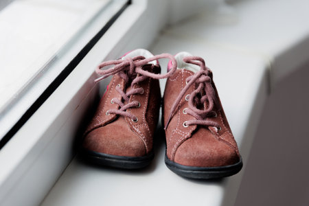 Close up, childrens crimson shoes, baby little girl shoes. for newborn girl, shoes for children.の写真素材