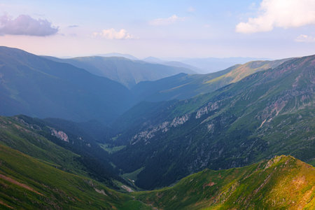 Beautiful majestic mountain wallpaper, tourist destination, hacking. extraordinary landscape of the fagaras mountains romanian. no people. Mountain green valley panoramic landscape with big peaksの写真素材
