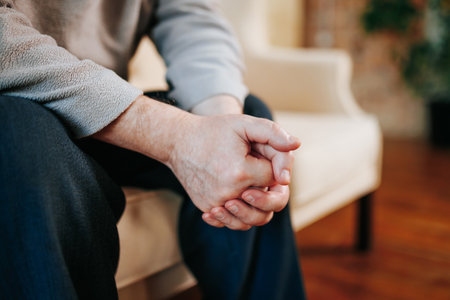 the hands of a senior man close up, he is at the psychiatrist. top viewの写真素材