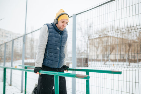 Gymnastics in the Winter Wonder This photo showcases a man performing gymnastics training in the...
