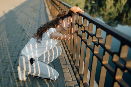 Fitness Healthy Lifestyle Young Woman make a break after running in the forest. Caucasian brunette female exercising outdoor, Sport lifestyle.の写真素材