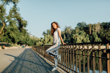 Fitness Healthy Lifestyle Young Woman make a break after running in the forest. Caucasian brunette female exercising outdoor, Sport lifestyle.の写真素材