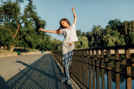 Fitness Healthy Lifestyle Young Woman make a break after running in the forest. Caucasian brunette female exercising outdoor, Sport lifestyle.の写真素材