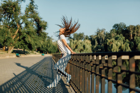 Fitness Healthy Lifestyle Young Woman make a break after running in the forest. Caucasian brunette female exercising outdoor, Sport lifestyle.の写真素材