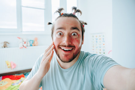 This picture features a satisfied and glad man in his 30s, with a full smile and a twinkle in his eyes. He is obviously having a funny and humorous moment,の写真素材