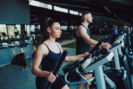Hispanic man and Caucasian woman fitness. Fit Man and Woman Engaging in Cardio Workout Routine. Energetic Hispanic and American Pair Exercising for Healthの写真素材