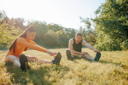 Sporty Morning Two People Engaging in Outdoor Workout. Outdoor Fitness Determined Man and Woman Training Together, Athleticspiritの写真素材