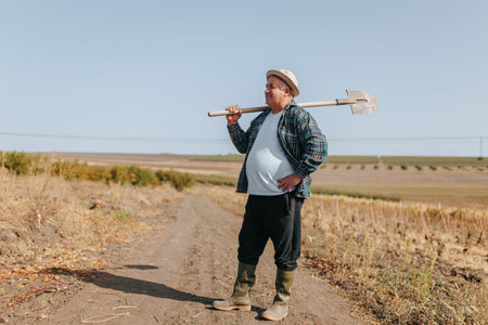 Rural Wisdom An Old Farmer Embracing the Countryside, Shovel in Hand, as He Works on His Beloved...