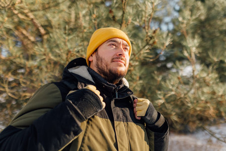 Snowy Serenity Amidst the tranquil snowy trails, a contemplative Hispanic hiker finds solace and...