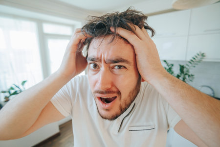 The power of wonder is beautifully captured in this spellbinding close up, where tousled hair frames a face wearing an astonished look and captivating viewers.の写真素材