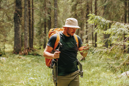Ecological Exploration A Happy Hikers Successful Study of Natures . Scientific Triumph in the Woods Joyful Hiker Examining Forest Floraの写真素材