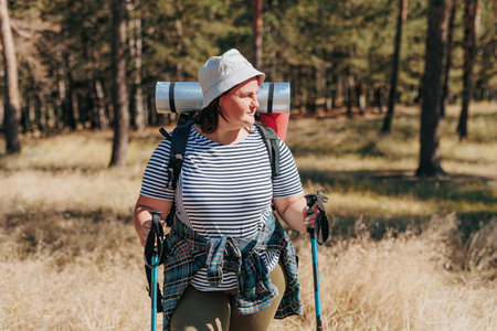 Immerse yourself in the beauty of an active lifestyle with a plus-size American womans solo hiking expedition. This video captures the essence of her journey through nature,の写真素材