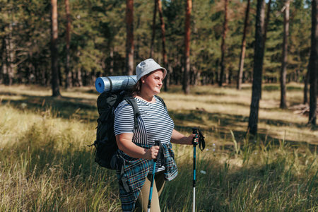 Traverse the Trails of Tranquility as an American Hiker, a Plus-Size Female, Embarks on a Nature-Fueled Journey. Discover the Bold Contours of Freedom in the Wilderness,の写真素材