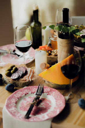 Table with a pink plate and a fork and knife on itの写真素材