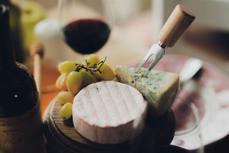 Cheese plate with a fork and knife on itの写真素材