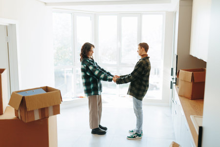Side view of a happy couple hugging in their cozy apartment renovation
