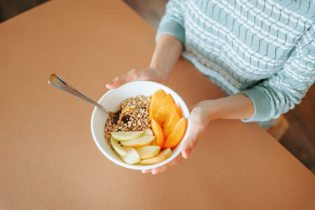 Delicious healthy breakfast bowl with fruits and granola at home