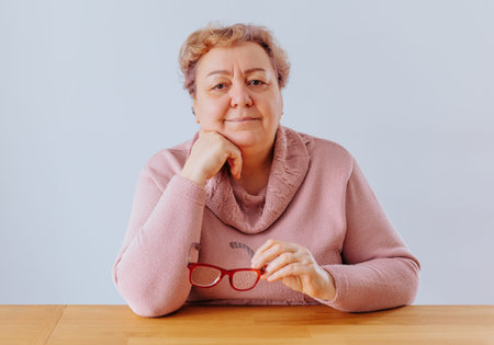 Well-dressed woman enjoying a quiet moment at home in cozy sweater