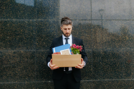 Unemployed Man in Suit Looking Sad After Corporate Layoff