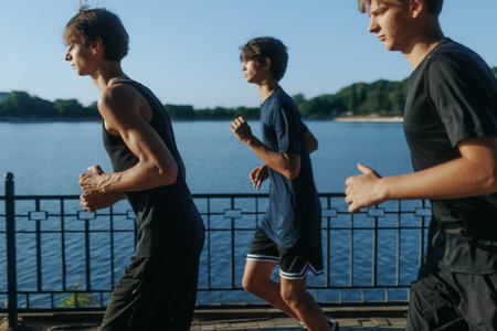 Teenagers Jogging Together in Park at Sunset Living a Healthy Lifestyle