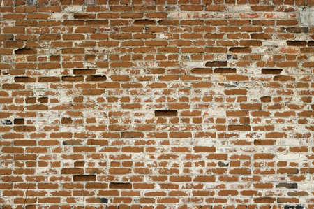 Old brick wall with white seams