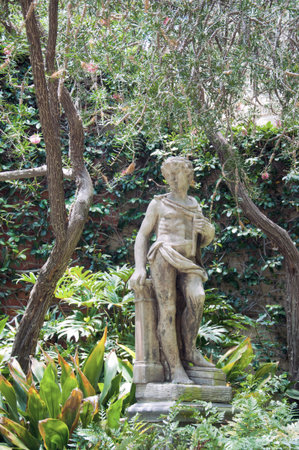 Trees and sculpture on a bright summer dayの写真素材