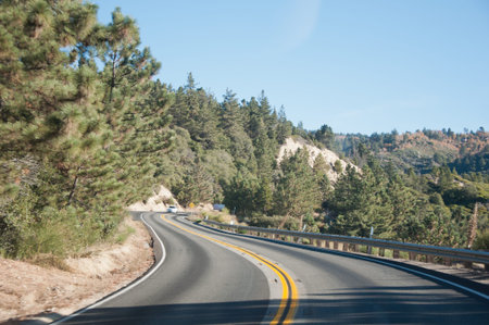 Beautiful curling road in mountains in sunny day