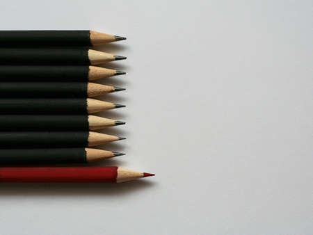 Red pensil among black. The concept of leader in the teamの写真素材