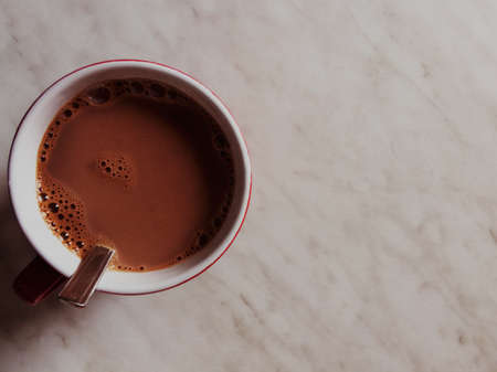 A Cup of cocoa on top on a light background. Copy spaceの写真素材