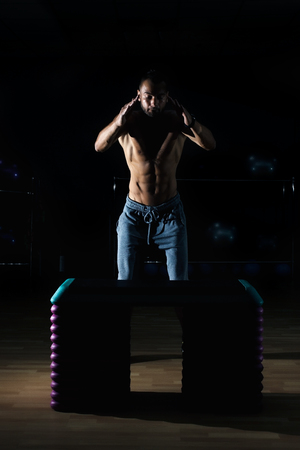 Athlete gave exercise. Jumping on the box. Phase touchdown.の写真素材