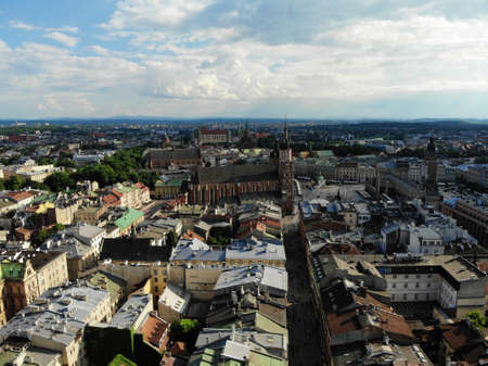 Aerial photo from drone. The culture and historical capital of Poland. Comfortable and beautiful Krakow. The land of Legend. Old part of town,Main square, St. Mary's Basilica.の写真素材