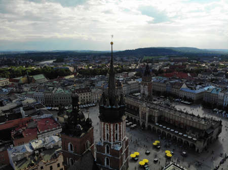Aerial photo from drone. The culture and historical capital of Poland. Comfortable and beautiful Krakow. The land of Legend. Old part of town,Main square, St. Mary's Basilica.の写真素材