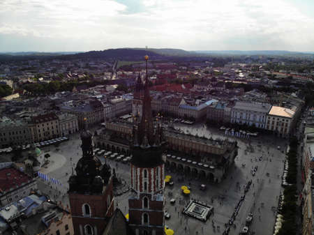 Aerial photo from drone. The culture and historical capital of Poland. Comfortable and beautiful Krakow. The land of Legend. Old part of town,Main square, St. Mary's Basilica.の写真素材