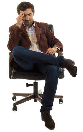 A pensive young caucasian business man isolated on white backgroundの写真素材