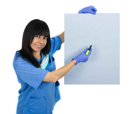 Latin doctor with surgical uniform holding a banner, isolated on whiteの写真素材