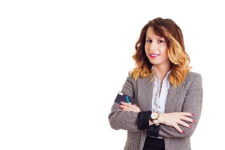 Smiling businesswoman  with credit card, white backgroundの写真素材