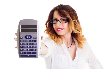 Smiling businesswoman with calculator isolated on whiteの写真素材