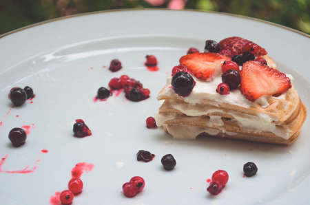 Waffles with fresh berries and creamの写真素材