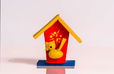 Wooden bird nest on a white backgroundの写真素材