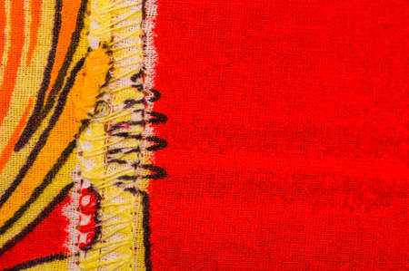 Sewn cloth background in orange yellow and redの写真素材