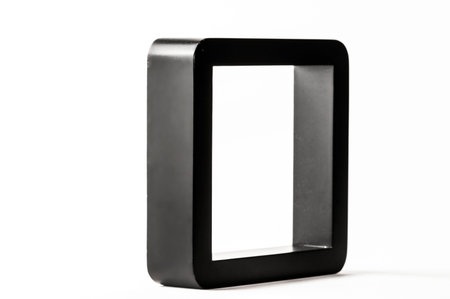 Empty black frame on white background seen from one side