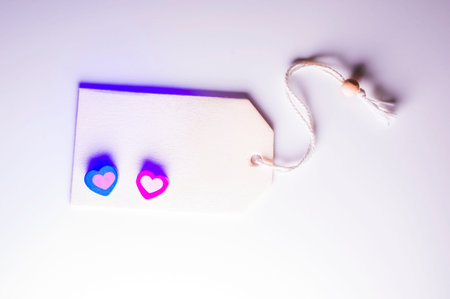 Two little hearts with room for text on white