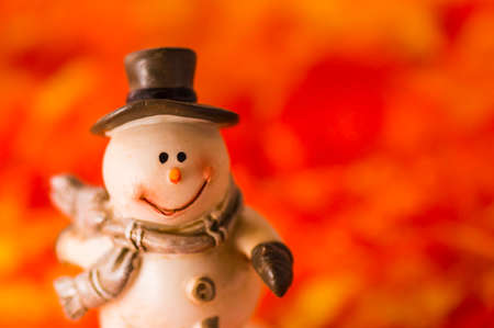 Happy snowman on red backgroundの写真素材